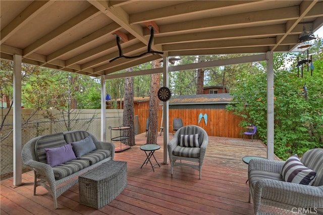 wooden terrace featuring outdoor lounge area