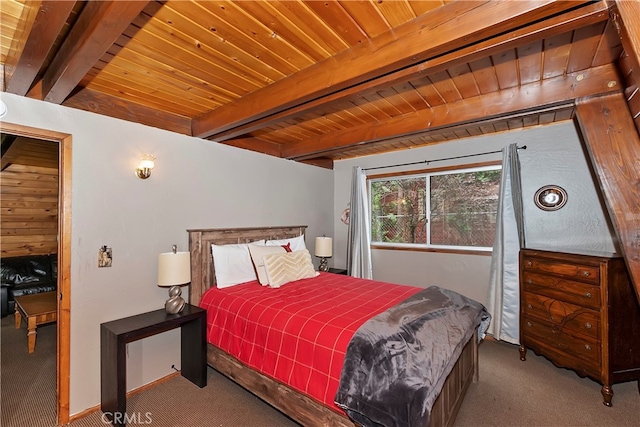 carpeted bedroom featuring beam ceiling and wooden ceiling