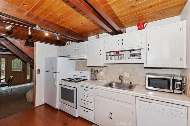 kitchen with dark hardwood / wood-style floors, custom range hood, sink, white cabinets, and white appliances