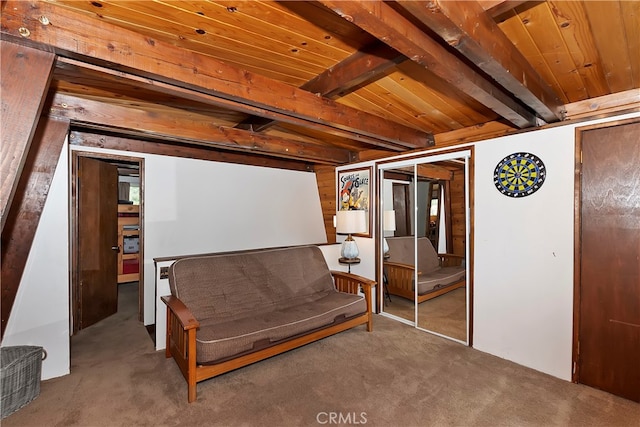 living area featuring vaulted ceiling with beams, carpet floors, and wooden ceiling