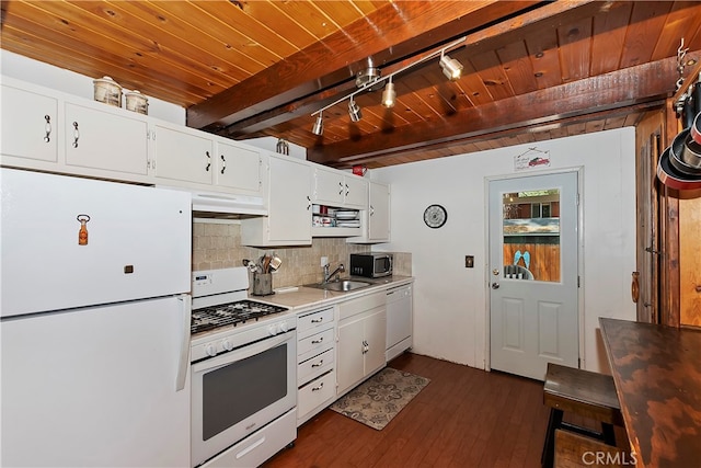 kitchen with dark hardwood / wood-style floors, beam ceiling, sink, white cabinetry, and white appliances