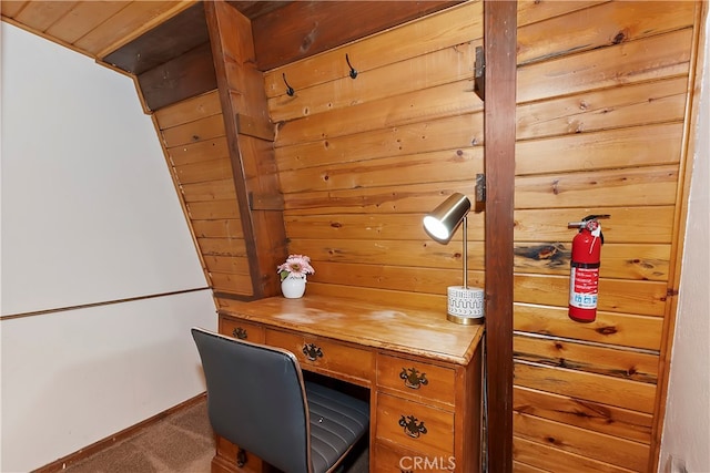 office space with wooden ceiling and dark carpet