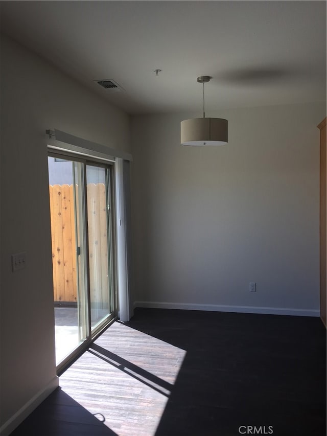 empty room featuring dark hardwood / wood-style floors