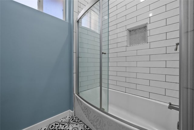 bathroom with tile patterned floors and enclosed tub / shower combo