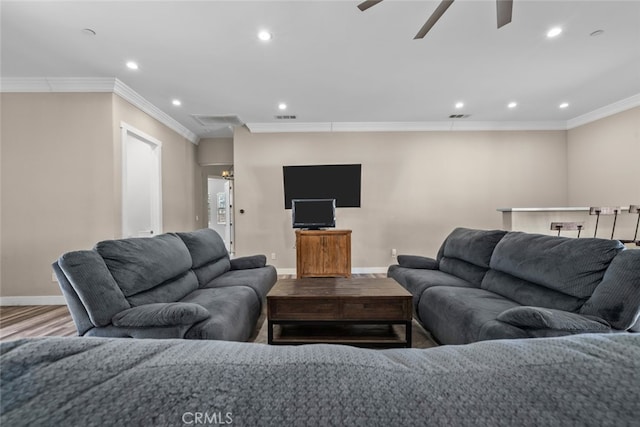 living room with hardwood / wood-style floors, ceiling fan, and ornamental molding