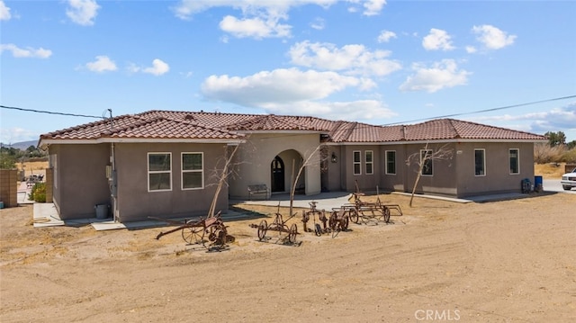 rear view of house featuring a patio