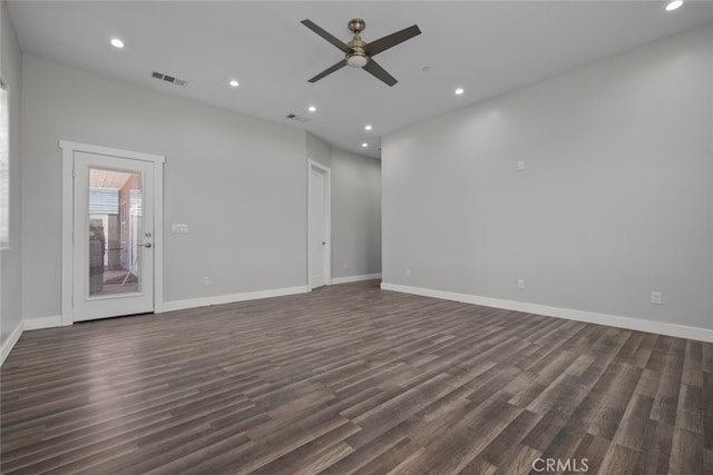 unfurnished living room with ceiling fan and dark wood-type flooring