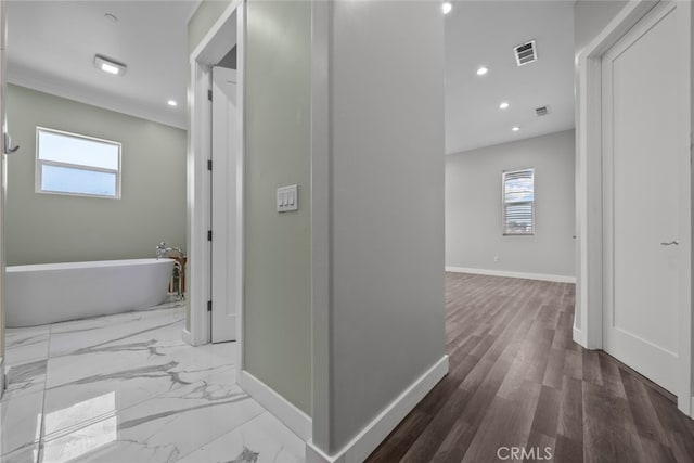 hallway with hardwood / wood-style flooring