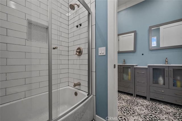 bathroom featuring shower / bath combination with glass door and sink