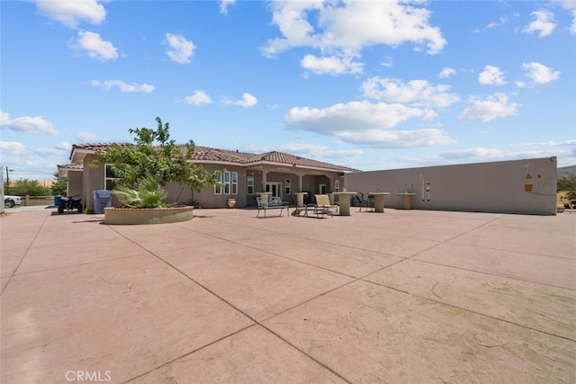 back of property with a patio area