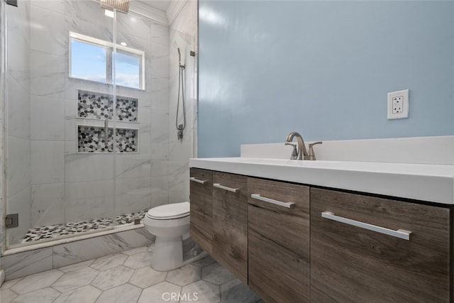 bathroom featuring tile patterned flooring, vanity, toilet, and walk in shower