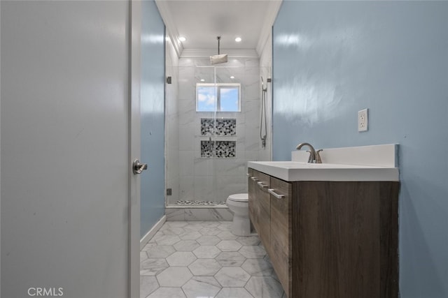 bathroom featuring tile patterned floors, crown molding, toilet, a shower with door, and vanity