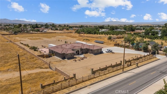 drone / aerial view with a mountain view and a rural view