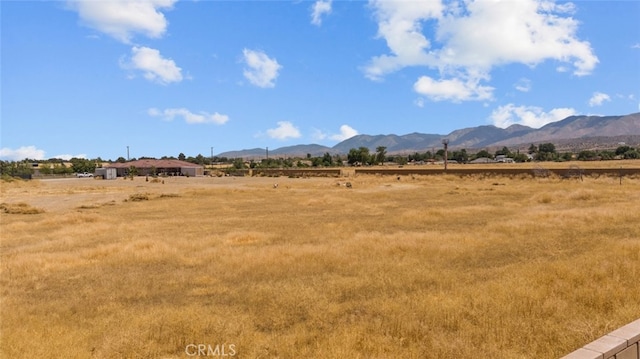 property view of mountains featuring a rural view