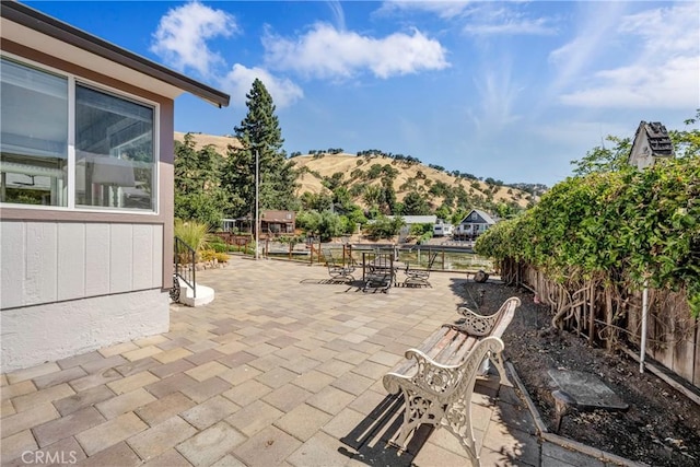 7722 Cora Dr, Lucerne, CA 95458 - view of patio with outdoor dining area and a mountain view