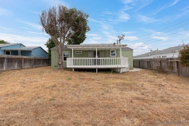 back of house featuring a deck