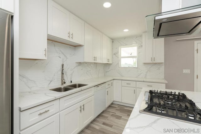 kitchen with white cabinetry, black gas cooktop, dishwasher, and light stone counters