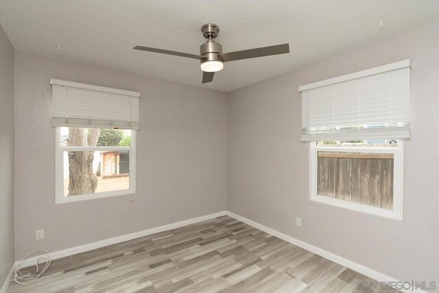 unfurnished room featuring ceiling fan and light hardwood / wood-style floors