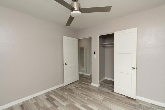 unfurnished bedroom with ceiling fan and light hardwood / wood-style flooring