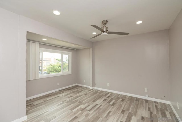 empty room featuring ceiling fan and light wood-type flooring