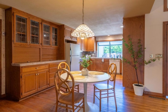 dining space featuring light hardwood / wood-style floors