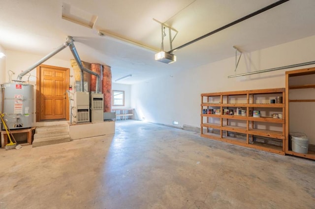 garage with strapped water heater and a garage door opener