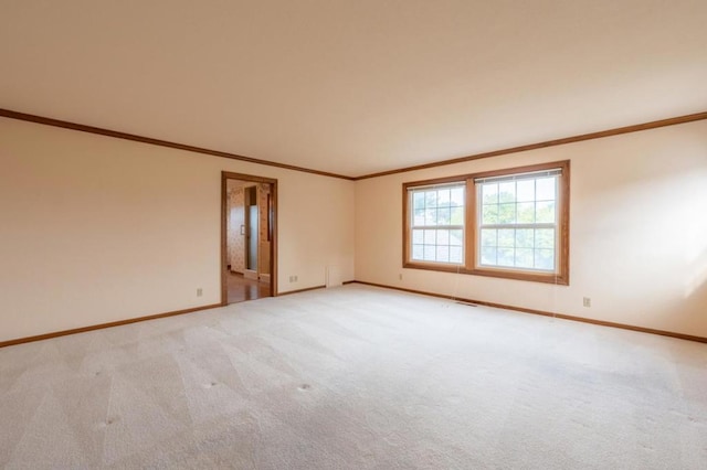 unfurnished room with light carpet and ornamental molding