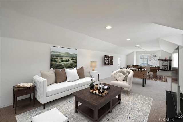 carpeted living room featuring lofted ceiling