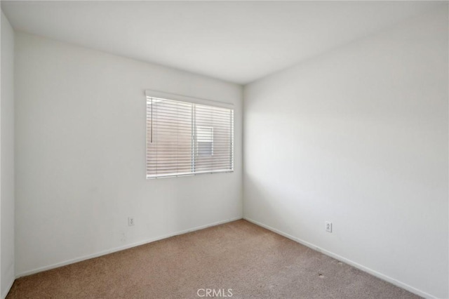 empty room with light colored carpet