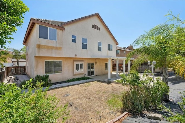 back of house featuring a patio area and a pergola