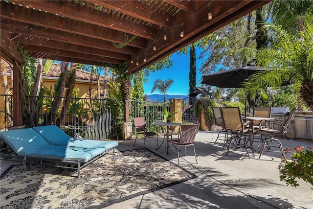 view of patio / terrace featuring outdoor dining area and fence