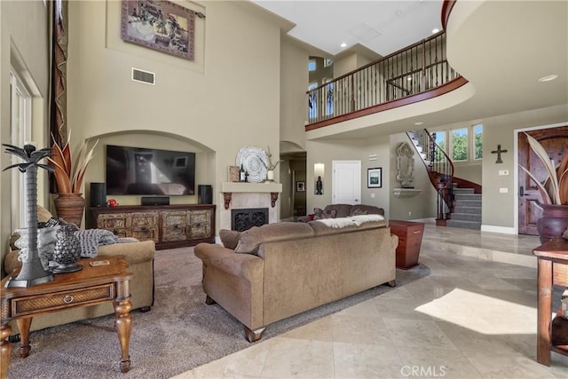 living room featuring a towering ceiling