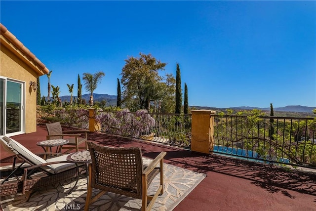 view of patio / terrace with a mountain view