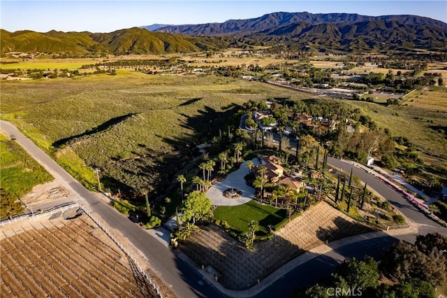 birds eye view of property with a mountain view