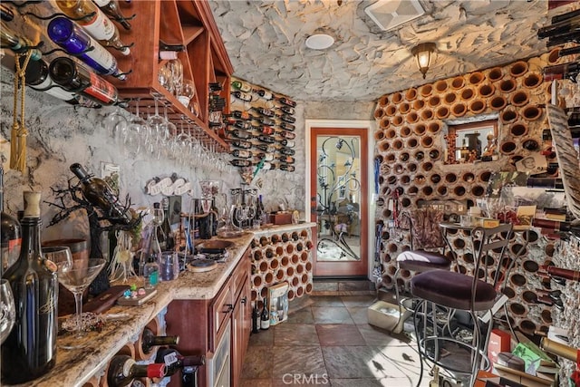 wine cellar with stone tile floors