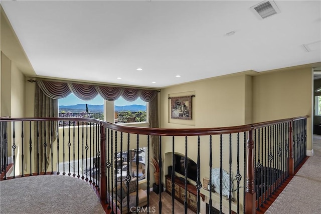 hall with carpet, visible vents, and recessed lighting