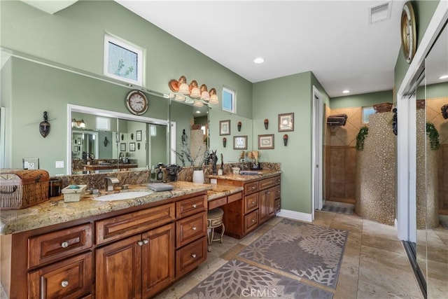 bathroom with recessed lighting, vanity, visible vents, tile patterned floors, and a stall shower