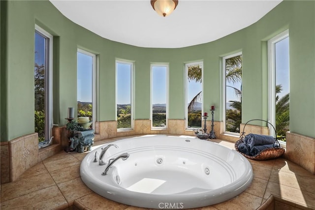 full bathroom with a whirlpool tub