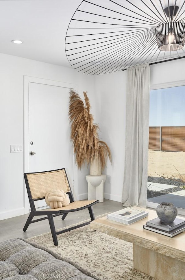 living area with concrete flooring