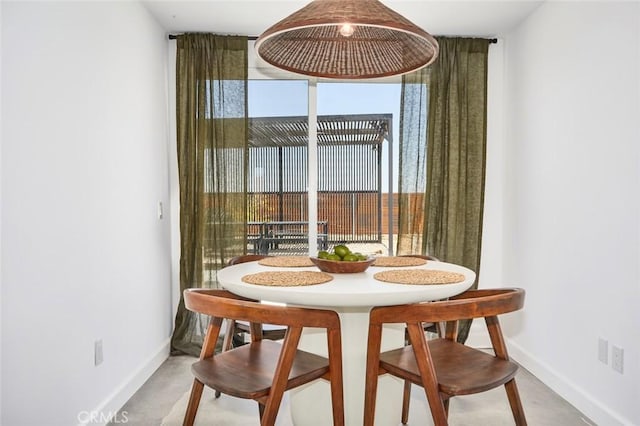 dining area with concrete floors