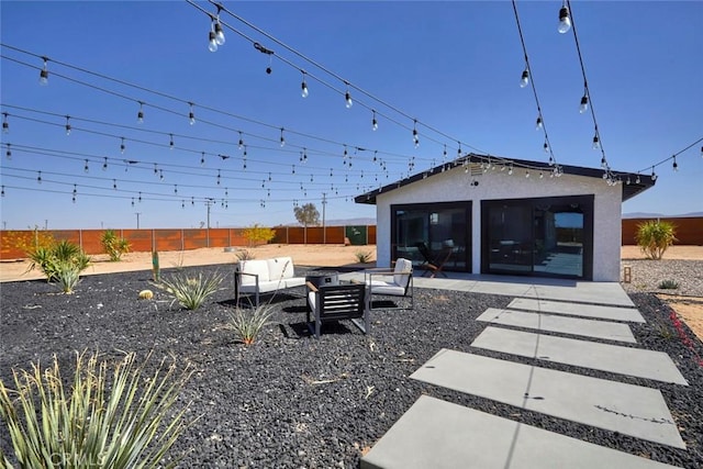 view of yard with outdoor lounge area, an outbuilding, and a patio area