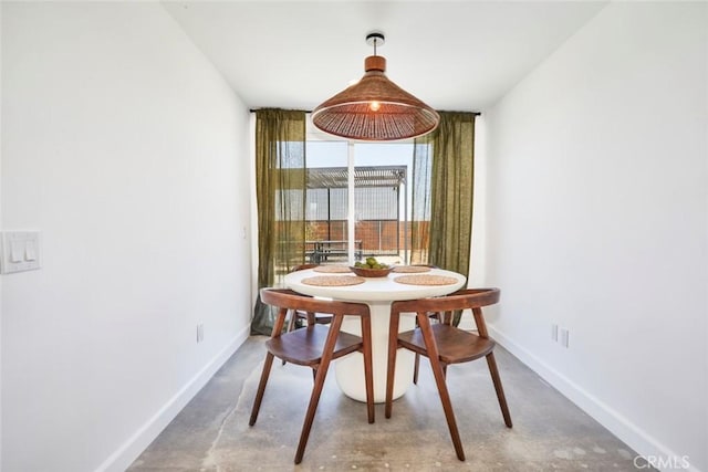 dining space with concrete floors