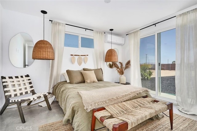 bedroom with a wall mounted AC, concrete flooring, and multiple windows