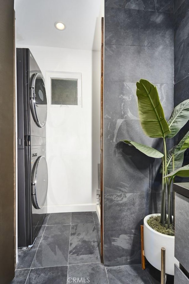 bathroom with stacked washer / dryer