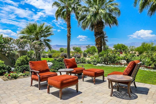 view of patio / terrace featuring a mountain view