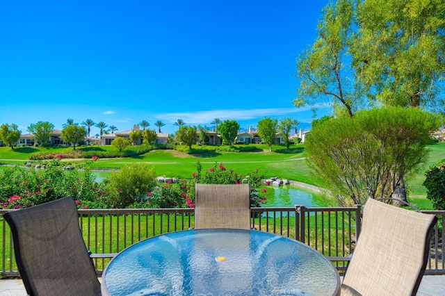 exterior space featuring a water view and a yard