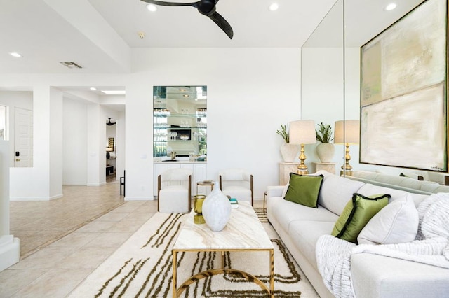 living room featuring ceiling fan and light tile patterned flooring