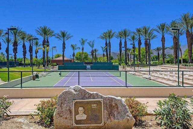 view of tennis court with a mountain view