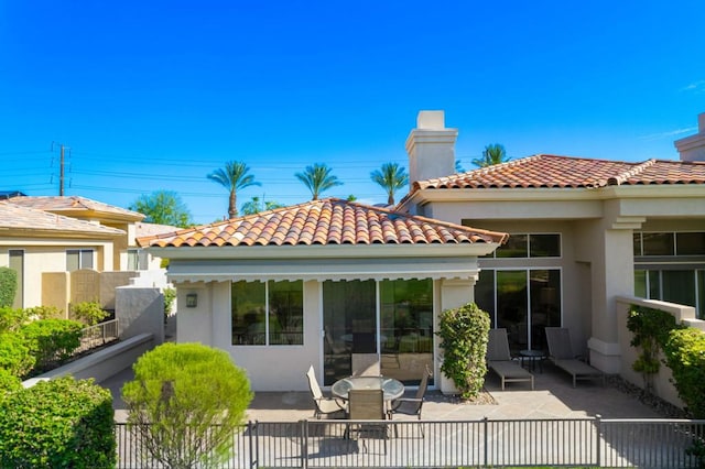 rear view of house with a patio