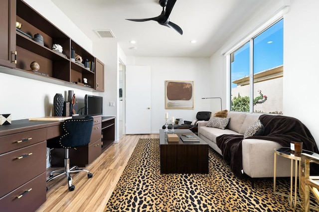 office area featuring light hardwood / wood-style flooring and ceiling fan